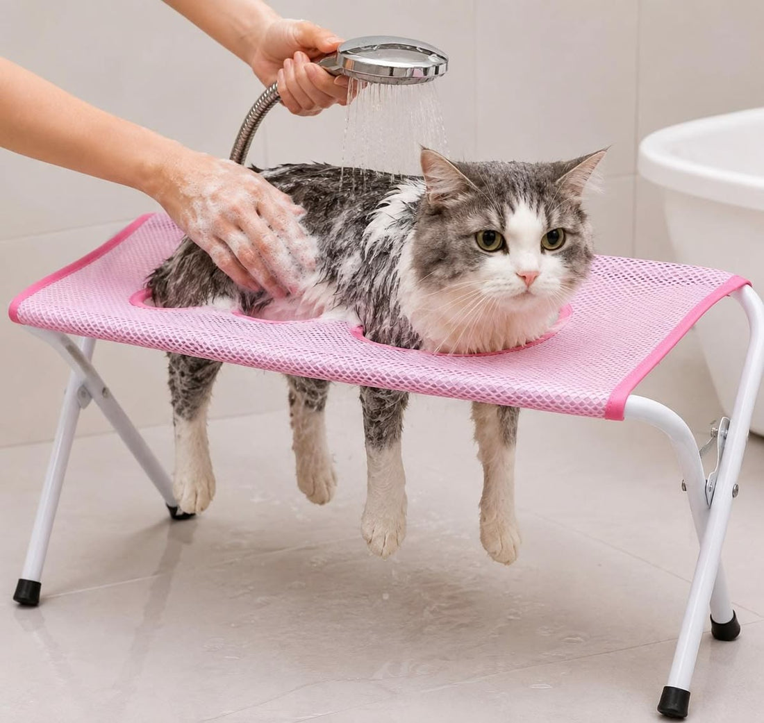 Pet grooming hammock used while bathing a cat